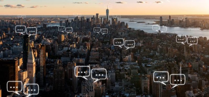 Chat bubbles outside the buildings